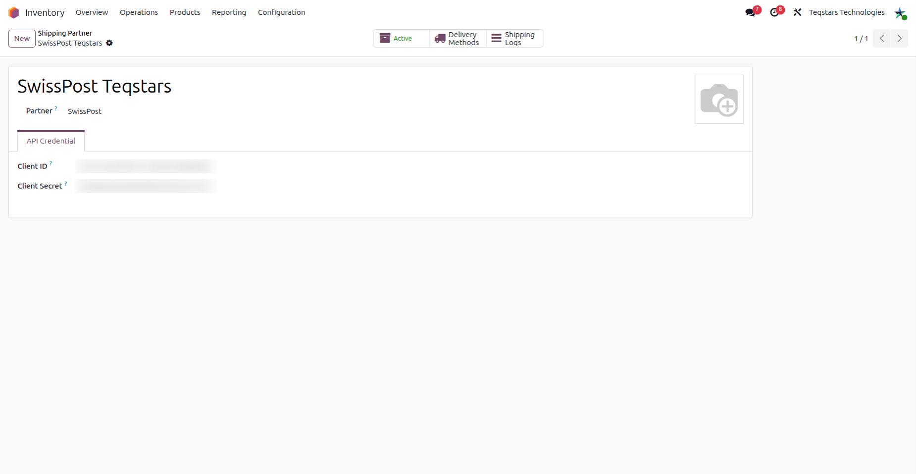 The Swiss Post shipping partner form with the Name, Partner and the API Credential tab showing Client ID and Client Secret.